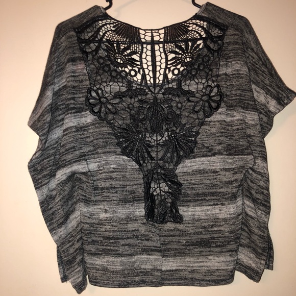 A black blouse. With a lacey design in the back - Picture 2 of 6